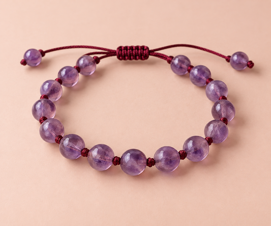 Amethyst beads on a hand-knotted burgundy silk cord.