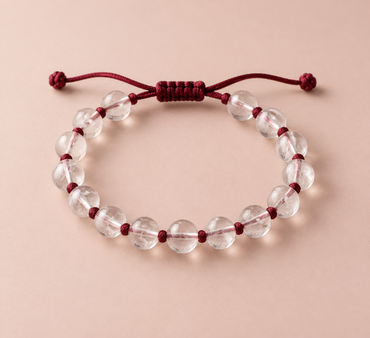 Clear quartz beads on a hand-knotted burgundy silk cord.