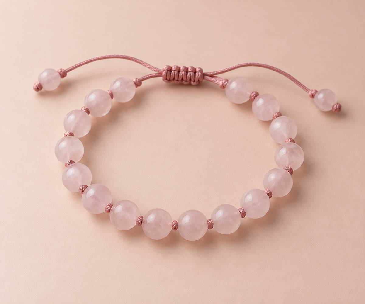 Rose quartz beads on a hand-knotted dusty rose silk cord.